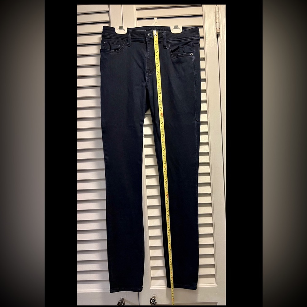 DL1961 dark wash skinny jeans.